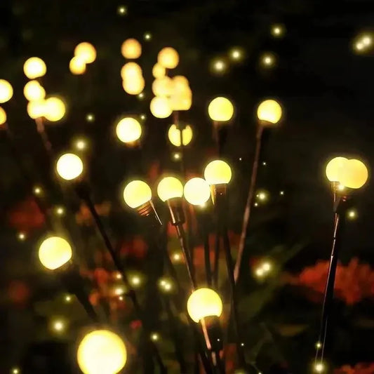 Solar LED pathway lights lining a garden path at night