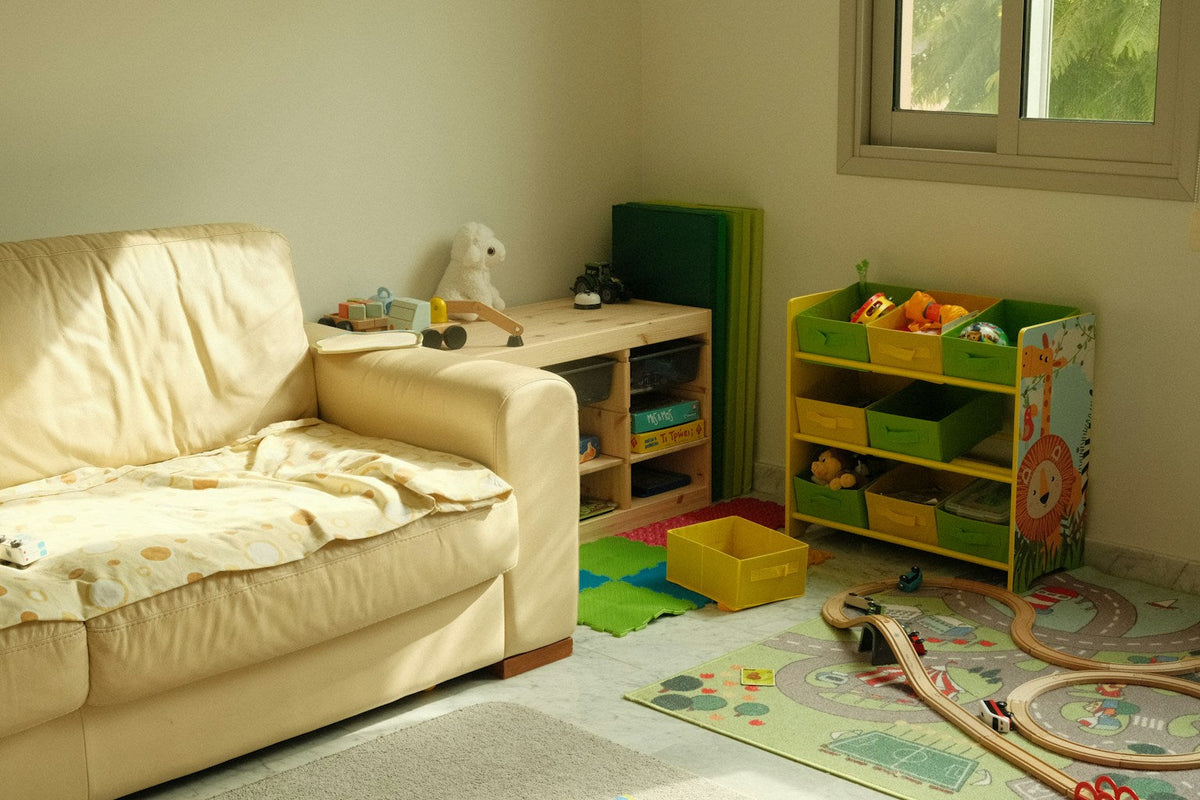 Children’s playroom with toys and storage, illustrating organised toy zones and accessible playroom shelving